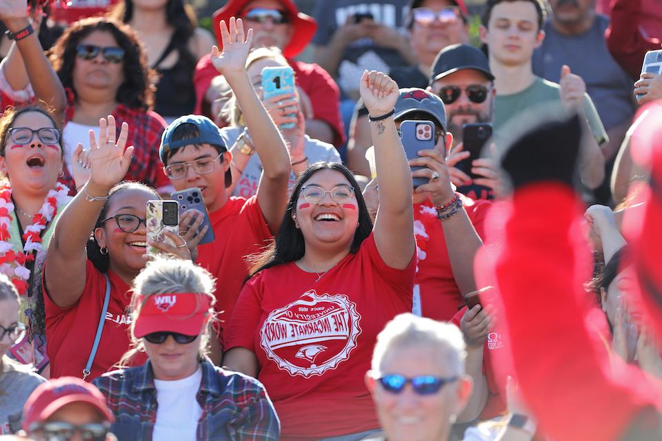 Crowd of people cheering at Homecoming event in 2022